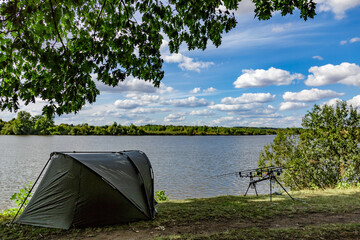 Carpfishing session at the Lake.Carp Angling scenic landscape overlooking lake at Dawn.Fishing...