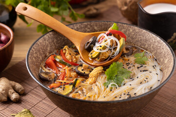 Thai soup with chicken, peppers and mushrooms. With the addition of coconut milk. Served in a...