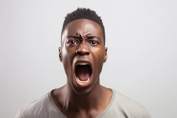 Fotobehang Portrait of african american angry man screaming on white background © Alina