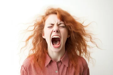 Fotobehang Portrait of young angry woman screaming on white background © Alina