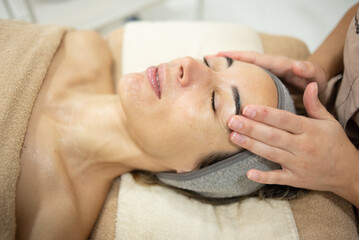 Woman receiving aesthetic and facial treatment at a professional clinic