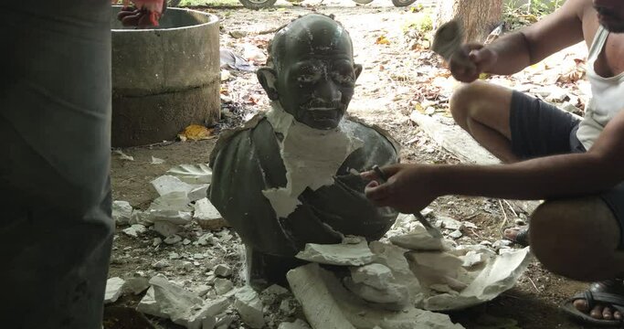 Artist is working and creates fibre half bust human man sculpture using plaster mold. Art and Sculpture.
