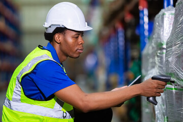 Male american african factory company employee scanning box checking number of products on goods...