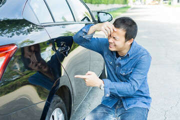Male on the road having problem with a car. Broken down car on the road. Young asian man with broken car on the road emergency car. Insurance concept, Traveling problem.