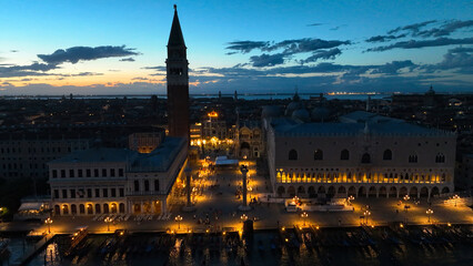 Venice panoramic cityscape landmark at sunset or night, aerial view of Piazza San Marco