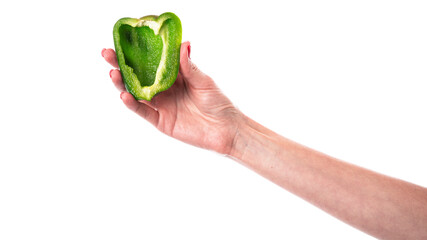 Green sweet bell pepper in hand isolated on a white background. Woman holding bulgarian pepper. Chopped pepper. Half of pepper.