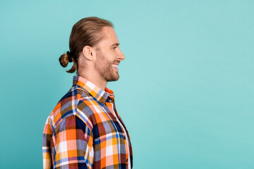Side profile photo of optimistic satisfied guy wear flannel shirt look at discount empty space...