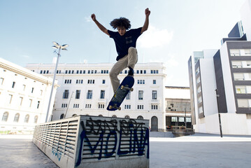 Skater performing flip on skateboard.