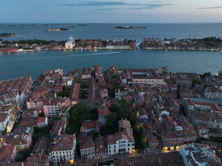 Venice panoramic cityscape landmark at sunset or night, aerial view of Piazza San Marco