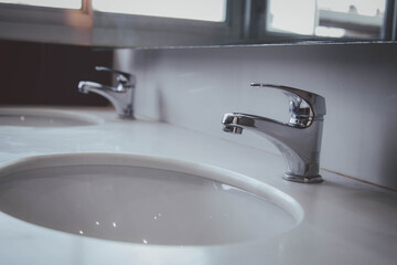 plumber at work in a bathroom, plumbing repair service , fix water plumbing leaks, replace the kitchen sink drain