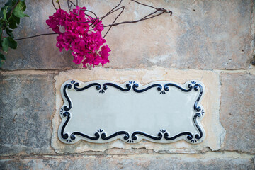 Traditional ceramic home sign board on wall