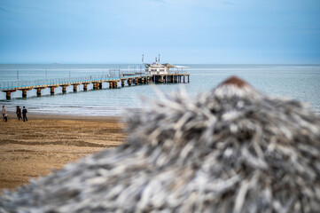 Lignano Pineta. the pier overlooking the sea and its spiral shape. - 712327549