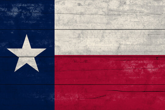 Texas State  flag on a wooden surface. Banner of the grunge Texas State  flag.