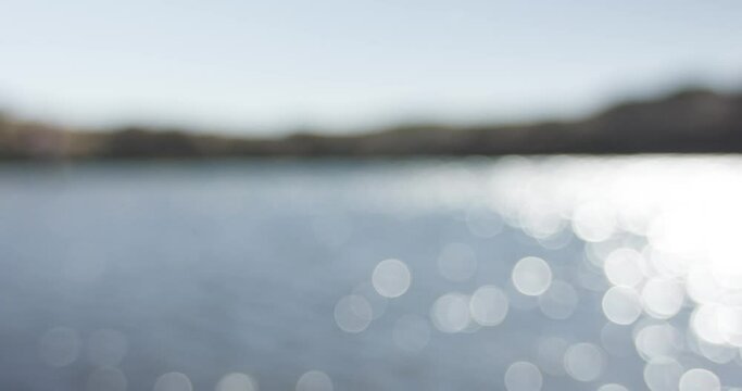out of focus bokeh texture of sunshine hitting the water