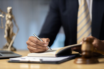 Male lawyer working at the desk in the office Justice and law, lawyer, court judge, concept.
