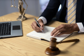 Male lawyer working at the desk in the office Justice and law, lawyer, court judge, concept.