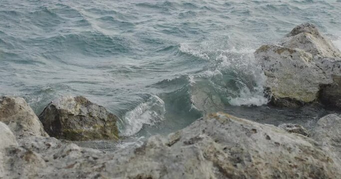 windy waves crashing on the lake shore