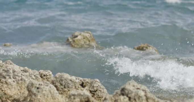 waves crashing on a rocky shore in slow motion
