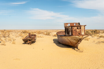 Rusty abandoned ships at the Ship cemetery at the former Aral sea coast in Moynaq Mo ynoq or Muynak...