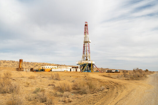Extraction of natural resources from bowels of the earth. Drilling rig for pumping gas in the Kyzylkum desert