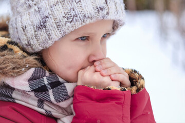 Shivering Child  in Winter Cold Weather. Little Girl Kid in warm outfit feels unwell and Discomfort...