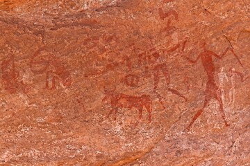 Rock art, petroglyph from the Neolithic period, depictions of human figures, Bouhadian rocks in Tadrart Rouge, Tassili N'Ajjer National Park. Sahara, Algeria, Africa.