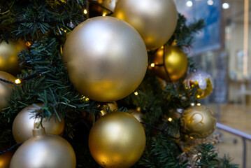 Merry Christmas and Happy New Year decorate the Christmas tree with light gold color balls