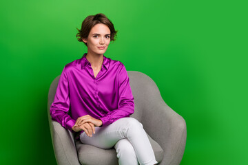 Obraz premium Photo of young lady sit armchair in office listening interesting candidate cv resume life history isolated on green color background