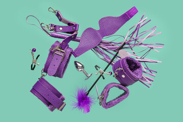 Flying sex toys on turquoise background