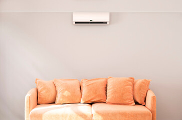 Air conditioner on a gray wall, seating area. 3d illustration. - 712358954