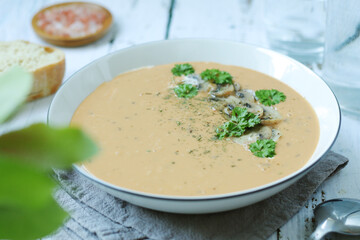 A bowl with mushroom cream soup