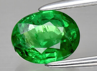 natural green tsavorite garnet gem on the background