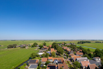 Typical Dutch polder in summer, Canal or ditch and green meadow, Overview from the top of Church tower in Ransdorp, A small village part of the municipality of Amsterdam, North Holland, Netherlands.