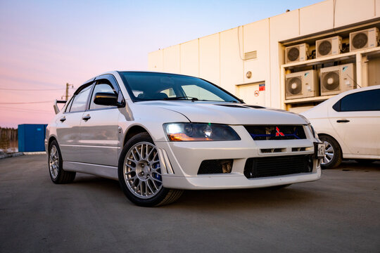 car on the road Mitsubishi Lancer Evolution