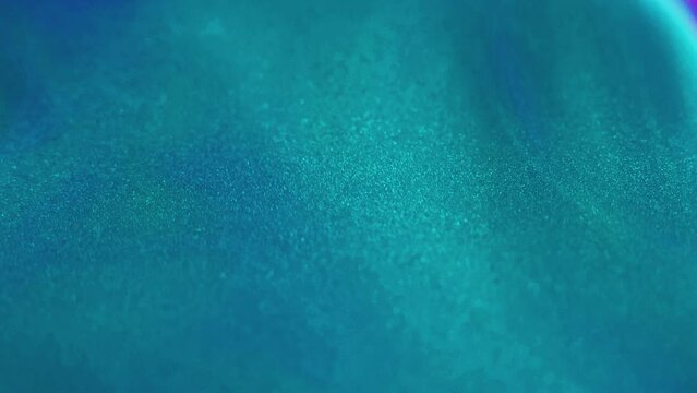 Paint splash in water. Glitter fluid. Blur vibrant green blue purple color sparkling oil ink emulsion bubbles wave flow opener motion abstract art background.