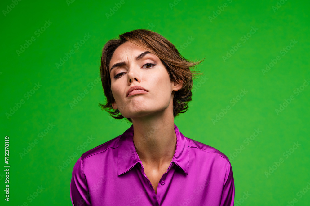 Sticker photo of doubtful minded pensive girl sullen face suspicious disbelief isolated on green color backg