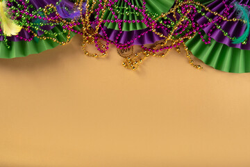 Mardi Gras colorful holiday greeting card background with festival masquerade accessories, decor,...