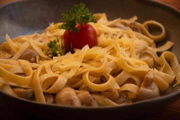 pasta with mushrooms in rustic dish