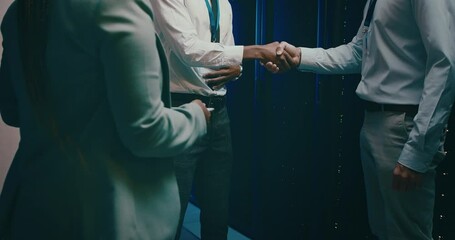 People, shaking hands and server room success, onboarding or cyber security agreement or programming. Business technician handshake for congratulations, deal or thank you in data center or promotion