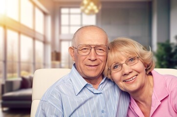 Happy senior hugging in living room