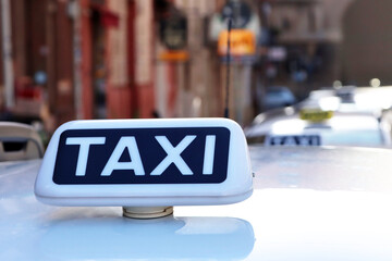 Italian white taxi sign, row of taxis