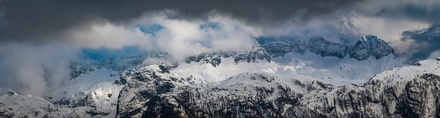 Fototapeta na wymiar Snow on Mount Canin and Montasio. Spring snow