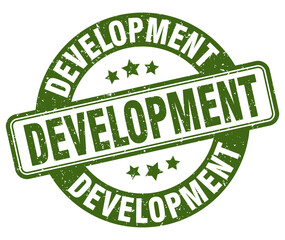 development stamp. development label. round grunge sign