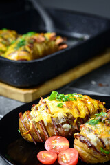 Hasselback potatoes with meat and herbs