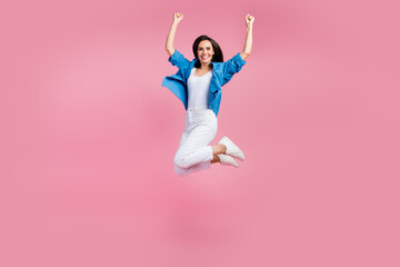 Full size photo of ecstatic satisfied girl dressed blue shirt white trousers fly hands up win...