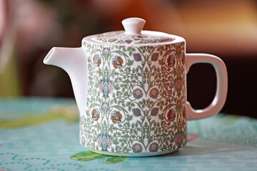 A beautiful ceramic pot with flowers.