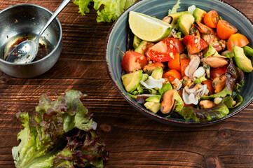 Homemade seafood salad with fish mussels, octopus.