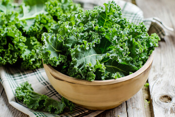 a bowl of kale above wooden table