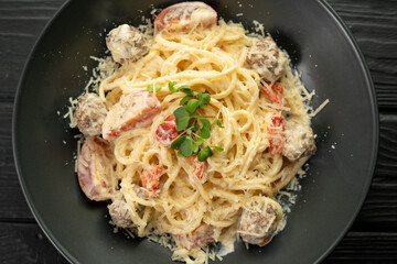 Italian pasta with meatballs on a plate in a restaurant. Food concept