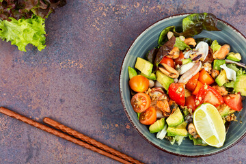 Homemade seafood salad with fish mussels, octopus.